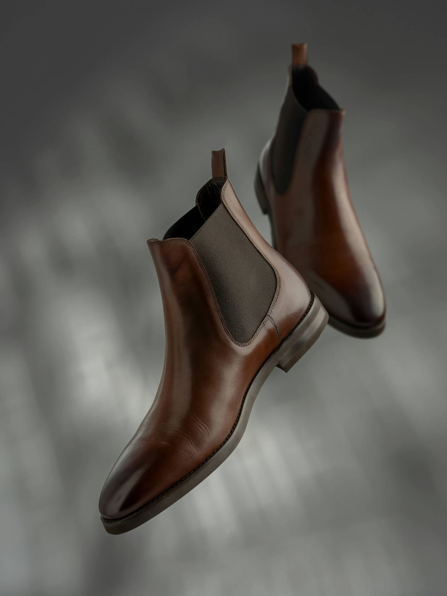 Brown leather Chelsea boots for structured, masculine style