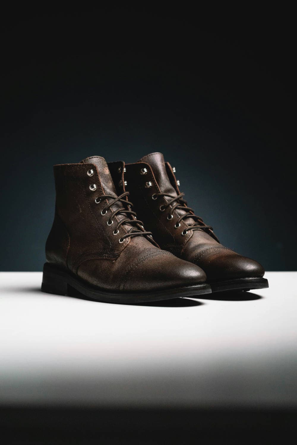 Brown leather boots styled with dark denim as classic mens style basics