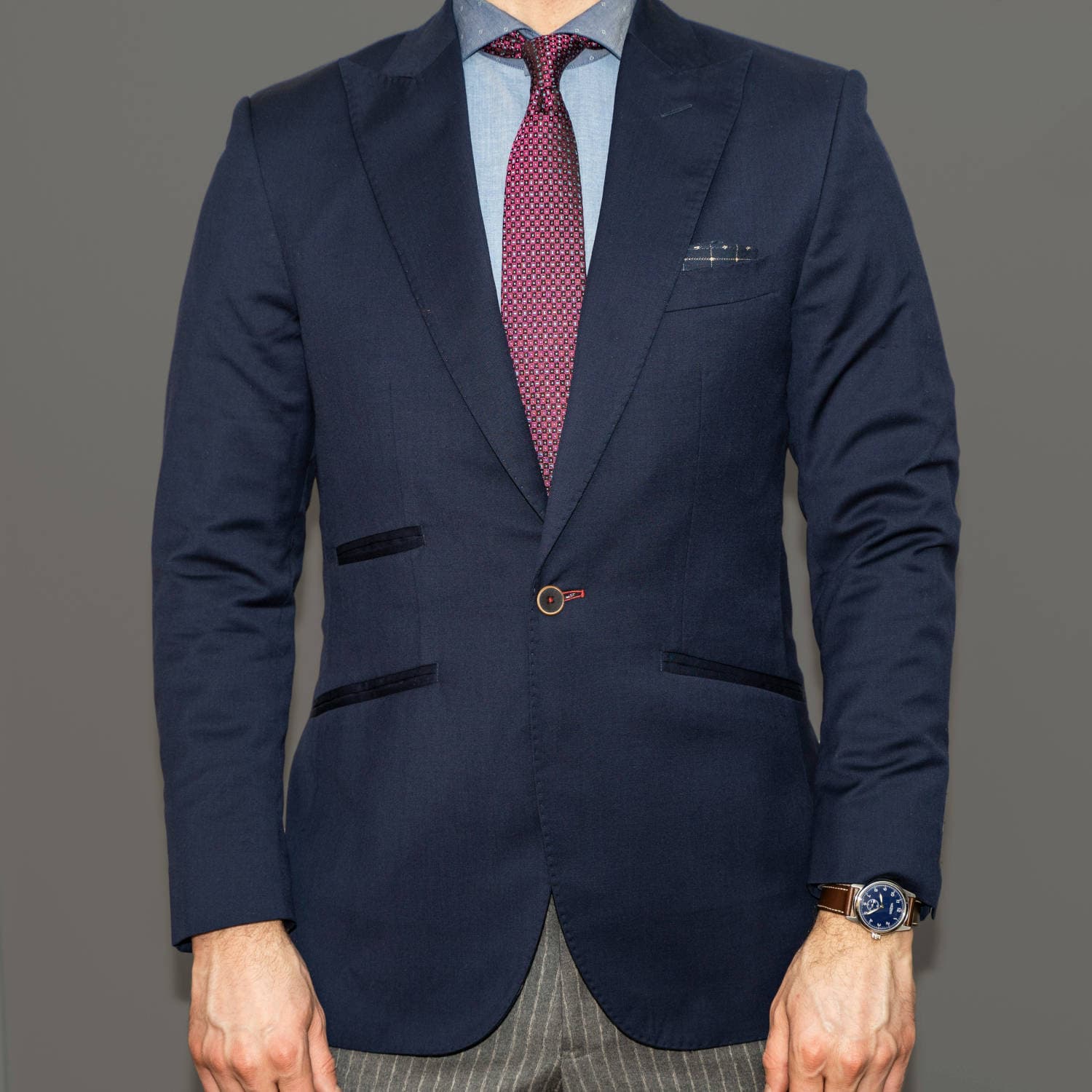 Navy blazer layered over basics in a capsule wardrobe men outfit